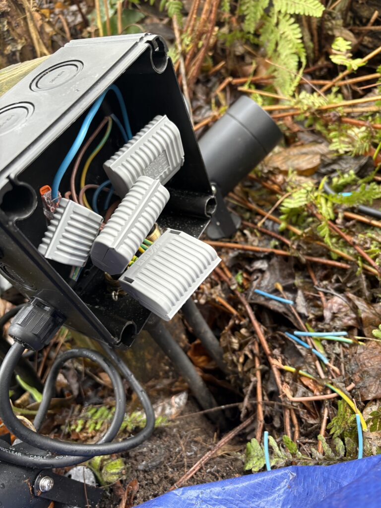 Wiring Garden Lights: Complete Installation Guide for Outdoor Lighting 4 Open WISKA waterproof junction box showing WAGO gel connection boxes inside, each containing WAGO connectors used to create sealed, moisture-resistant electrical connections suitable for outdoor installations such as garden lighting circuits.